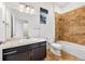 Bathroom featuring a tub and shower combination, updated sink, fixtures and flooring at 3751 W 136Th Ave # L1, Broomfield, CO 80023