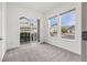 Bright bedroom with large windows and access to an outdoor area at 3751 W 136Th Ave # L1, Broomfield, CO 80023