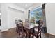 Elegant dining room with hardwood floors, a large window, and modern curtains at 3751 W 136Th Ave # L1, Broomfield, CO 80023