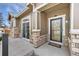 Charming front entrance with stone accents, a covered porch, and stylish door at 3751 W 136Th Ave # L1, Broomfield, CO 80023