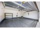 Spacious garage featuring high ceilings, shelving, and access to the home's interior at 3751 W 136Th Ave # L1, Broomfield, CO 80023