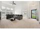 Open-concept living room with neutral carpet, natural light, and comfortable seating at 3751 W 136Th Ave # L1, Broomfield, CO 80023
