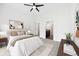 Inviting main bedroom with soft carpeting, ample natural light, and a view of the bathroom at 3751 W 136Th Ave # L1, Broomfield, CO 80023