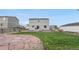 Backyard featuring a patio, grass, and fencing at 42853 Ivydel St, Elizabeth, CO 80107