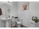 Charming powder room featuring a pedestal sink and tasteful decor at 42853 Ivydel St, Elizabeth, CO 80107