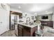Kitchen featuring granite countertops, stainless steel appliances, and seamless flow to the dining and living areas at 42853 Ivydel St, Elizabeth, CO 80107