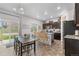 Stylish kitchen with dark wood cabinets, stainless steel appliances, and a breakfast bar with seating at 42853 Ivydel St, Elizabeth, CO 80107
