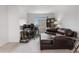 Comfortable living room area with a work station and a plush leather sofa at 42853 Ivydel St, Elizabeth, CO 80107
