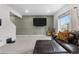 Inviting living room featuring a large sectional sofa and stylish accent wall at 42853 Ivydel St, Elizabeth, CO 80107