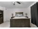 Spacious bedroom with a ceiling fan, complemented by stylish lamps and a comfortable bed at 42853 Ivydel St, Elizabeth, CO 80107