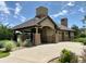 Community clubhouse with stone exterior and covered patio at 15827 E 107Th Way, Commerce City, CO 80022