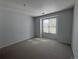 Carpeted bedroom with a window and neutral-colored walls at 6017 Castlegate Dr # F15, Castle Rock, CO 80108