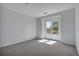 Bedroom with carpet and a sun filled window overlooking green space at 6017 Castlegate Dr # F15, Castle Rock, CO 80108