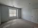 Carpeted bedroom features a window and a neutral-colored door at 6017 Castlegate Dr # F15, Castle Rock, CO 80108