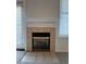 Cozy living room fireplace with tile surround at 6017 Castlegate Dr # F15, Castle Rock, CO 80108