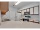 The bright kitchen features white cabinets and modern appliances at 6017 Castlegate Dr # F15, Castle Rock, CO 80108