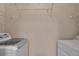 Laundry room features a washer and dryer, as well as extra shelving at 6017 Castlegate Dr # F15, Castle Rock, CO 80108