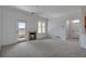 Cozy living room with a fireplace, plush carpet, and a door to the balcony at 6017 Castlegate Dr # F15, Castle Rock, CO 80108