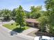 Street view of home with large, mature trees lining street and the nearby mountains visible from the street at 2901 Lorraine Ct, Boulder, CO 80304