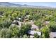 Mountains view from this tree-lined residential neighborhood featuring houses with well-manicured lawns at 2901 Lorraine Ct, Boulder, CO 80304