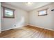 Bright bedroom features hardwood floors and natural light from two windows at 2901 Lorraine Ct, Boulder, CO 80304