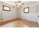 Bedroom features hardwood floors, a ceiling fan, and natural light at 2901 Lorraine Ct, Boulder, CO 80304