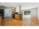 Open kitchen and living area featuring wood cabinets, tile floors, and natural light at 2901 Lorraine Ct, Boulder, CO 80304