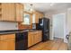 Bright kitchen featuring wood cabinets and black appliances at 2901 Lorraine Ct, Boulder, CO 80304