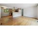 Open-concept living room with hardwood floors connected to kitchen and additional spaces at 2901 Lorraine Ct, Boulder, CO 80304