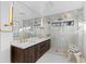 Spa-like bathroom with double vanity and walk-in shower at 7177 W 8Th Ave, Lakewood, CO 80214