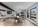 Open concept dining area with light hardwood floors and large windows at 7177 W 8Th Ave, Lakewood, CO 80214