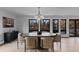 Elegant dining room features round table and contemporary light fixture at 7177 W 8Th Ave, Lakewood, CO 80214