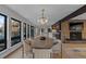 Modern dining room with large windows and an oval dining table at 7177 W 8Th Ave, Lakewood, CO 80214