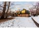 Back exterior of house with deck, covered patio, and landscaping; located on a waterway at 7177 W 8Th Ave, Lakewood, CO 80214