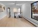 Bright hallway with hardwood floors and modern artwork at 7177 W 8Th Ave, Lakewood, CO 80214