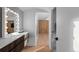 Modern vanity area with lighted mirror and built-in drawers at 7177 W 8Th Ave, Lakewood, CO 80214