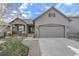 Charming home with a well-maintained lawn, a spacious garage, and attractive curb appeal at 2371 Pelican Bay Dr, Monument, CO 80132