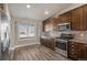 Well-lit kitchen featuring stainless steel appliances, sleek countertops, and ample cabinet space at 2371 Pelican Bay Dr, Monument, CO 80132