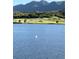 Beautiful lake with green pasture in the distance at 2371 Pelican Bay Dr, Monument, CO 80132