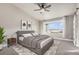 Serene main bedroom with a large window, plush bedding, and contemporary decor at 2371 Pelican Bay Dr, Monument, CO 80132