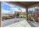 Covered patio features concrete flooring and view of the professionally landscaped yard at 2371 Pelican Bay Dr, Monument, CO 80132