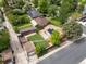 This home features solar panels, a well-manicured lawn, and a detached garage at 2690 Magnolia St, Denver, CO 80207