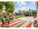 Charming backyard featuring a deck, patio seating, a shed, and lush green grass at 2690 Magnolia St, Denver, CO 80207