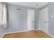 Empty bedroom with hardwood floors and two closets at 2690 Magnolia St, Denver, CO 80207