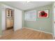 Bright bedroom with hardwood floors and a built in closet at 2690 Magnolia St, Denver, CO 80207