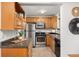 Efficient kitchen layout with stainless steel appliances, wood cabinets and lots of charm at 2690 Magnolia St, Denver, CO 80207