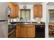 Well-maintained kitchen with wooden cabinets and modern appliances in a cozy setting at 2690 Magnolia St, Denver, CO 80207