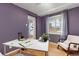 Purple walled office space with a desk, chair, light and a view to the world at 2690 Magnolia St, Denver, CO 80207