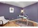 Cozy home office with wood floors, desk, chair, and soft lighting, ready for productivity at 2690 Magnolia St, Denver, CO 80207