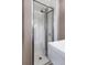 Modern shower with tiled walls, glass door, and updated fixtures at 2690 Magnolia St, Denver, CO 80207